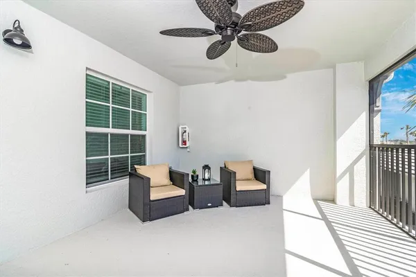 a living room with furniture and a window