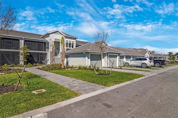 a view of a house with backyard porch and sitting area
