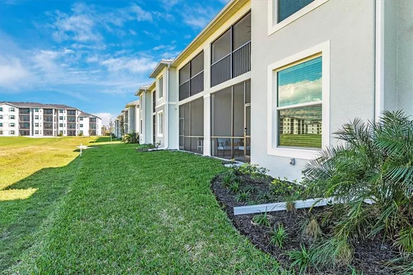 a view of a golf course with an ocean