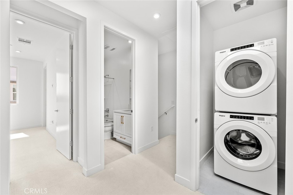 609 South Lyon Street Santa Ana, CA 92705 - Photo 21 of 52 a view of a hallway with washer and dryer