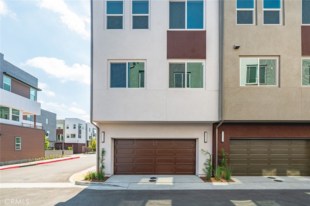 609 South Lyon Street Santa Ana, CA 92705 - Photo 31 of 52 a front view of a building with garage