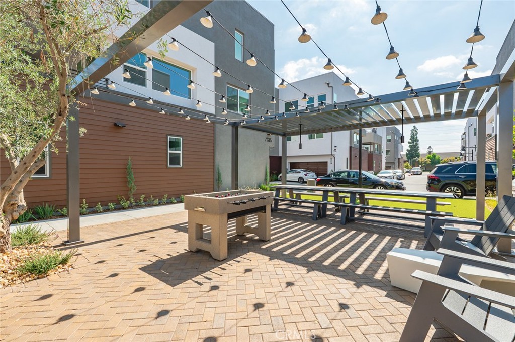 609 South Lyon Street Santa Ana, CA 92705 - Photo 34 of 52 a roof deck with a table and chairs