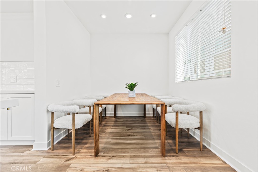 609 South Lyon Street Santa Ana, CA 92705 - Photo 6 of 52 a view of a dining room with furniture and wooden floor