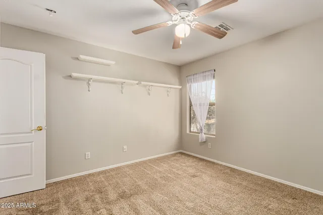 a view of an empty room with furniture