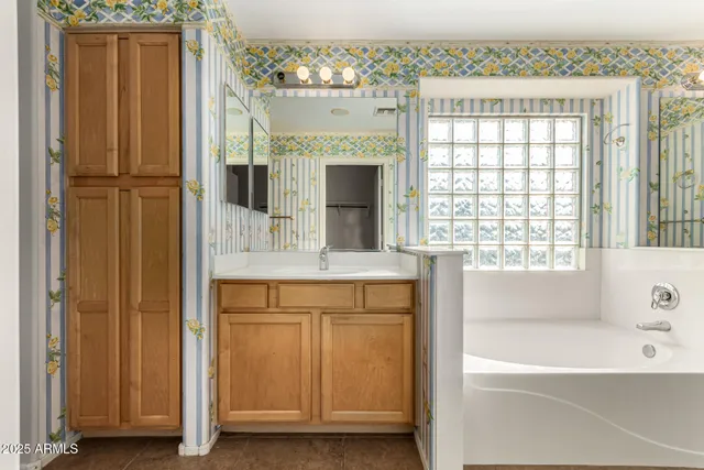 a view of a bathroom with a glass door and a glass door shower