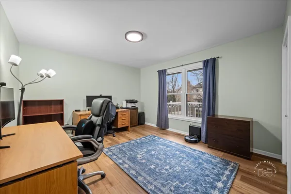 a living room with furniture rug and window