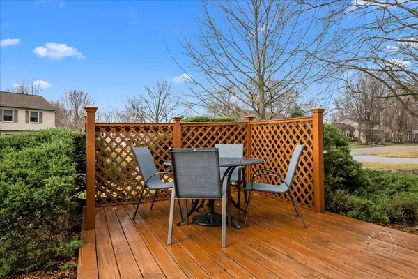 a view of a chairs and table on the deck