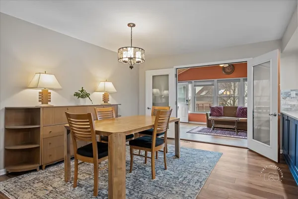 a view of a dining room with furniture window and wooden floor