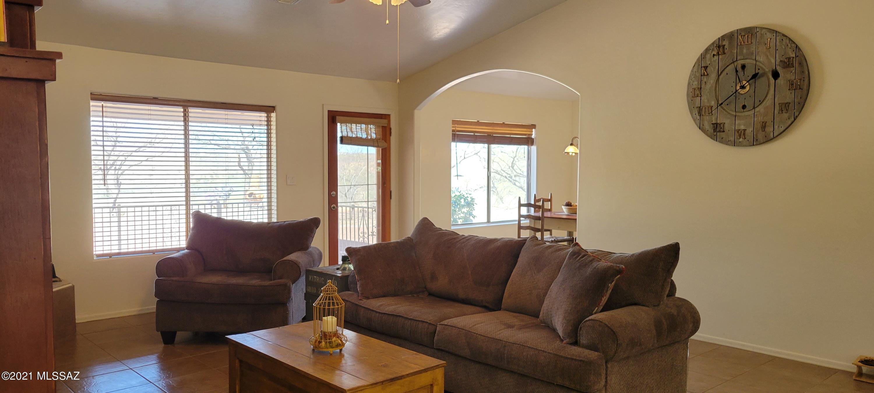 1704 Leary Court Rio Rico, AZ 85648 - Photo 19 of 37 a living room with furniture and a window