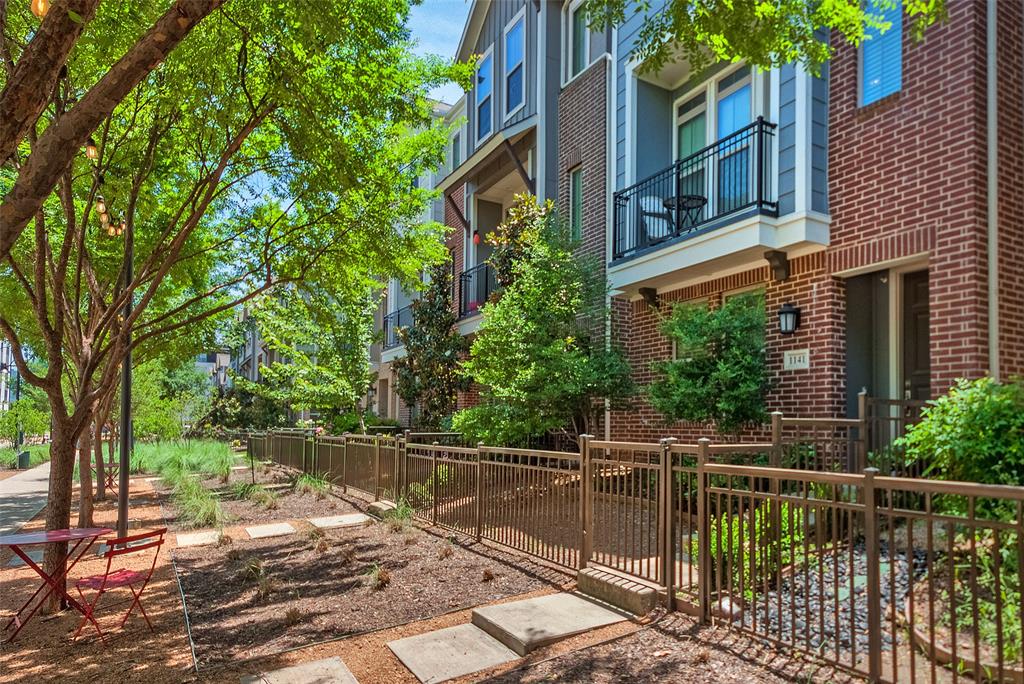 a view of a brick house with a large windows