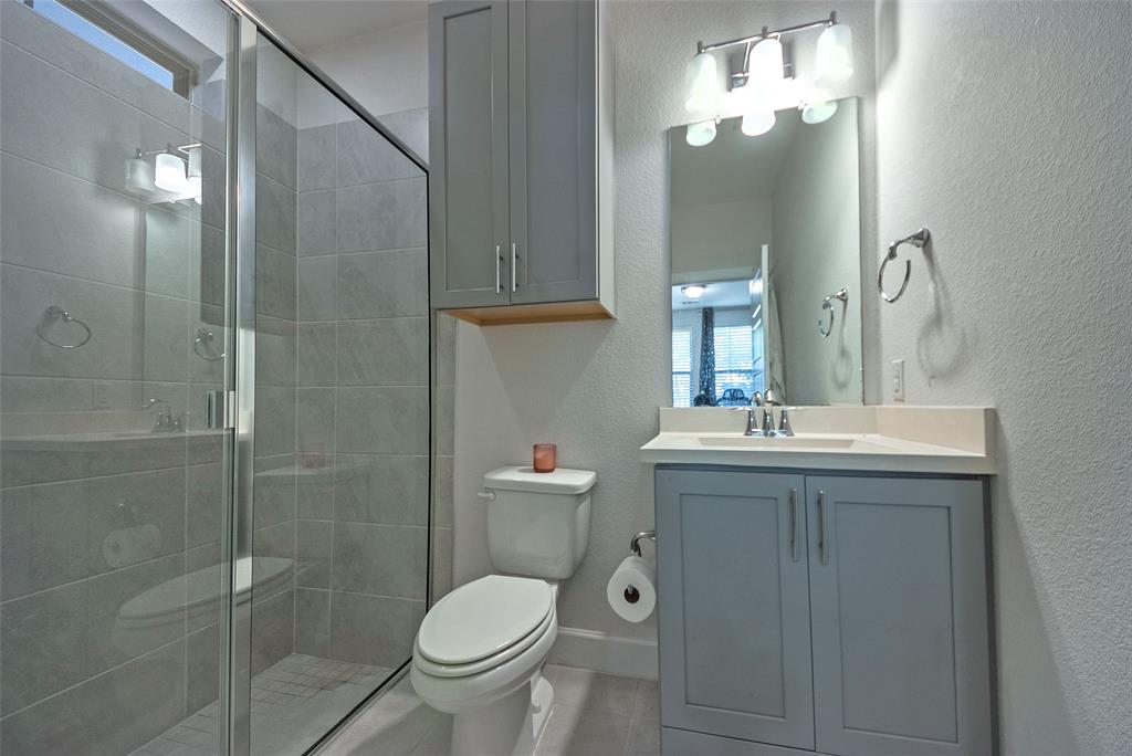 1141 Tea Olive Lane Dallas, TX 75212 - Photo 13 of 18 a bathroom with a sink toilet and shower