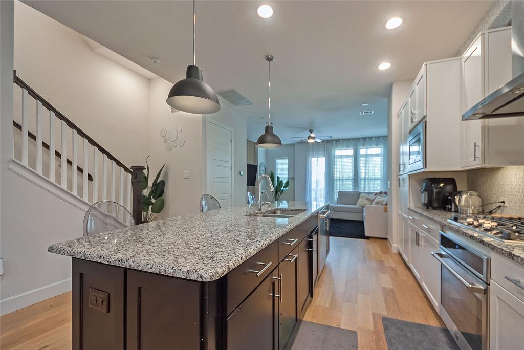 1141 Tea Olive Lane Dallas, TX 75212 - Photo 4 of 18 a kitchen with sink cabinets and stove