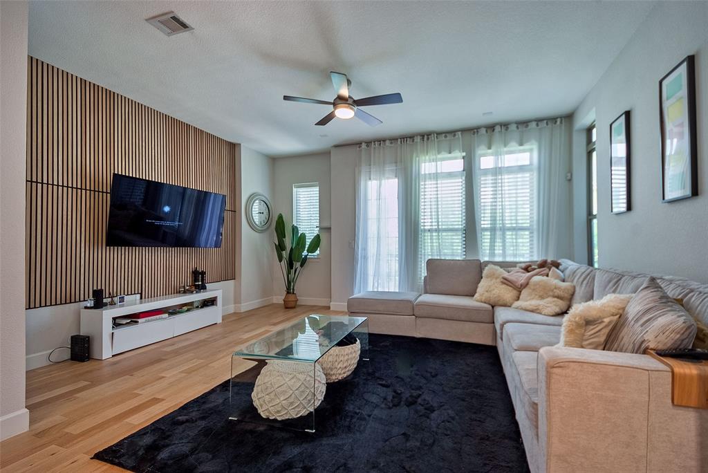 1141 Tea Olive Lane Dallas, TX 75212 - Photo 5 of 18 a living room with furniture and a flat screen tv