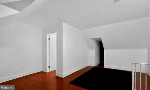 an empty room with wooden floor