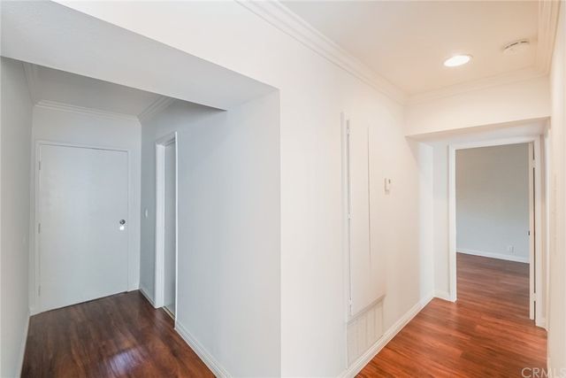 a view of hallway with wooden floor