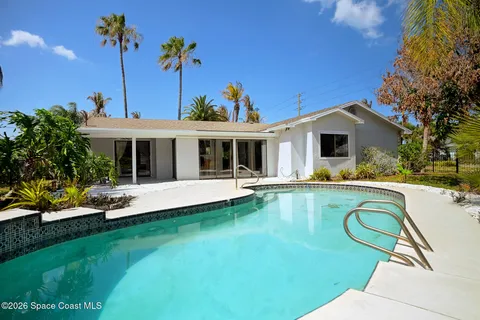 a view of a house with swimming pool yard and patio