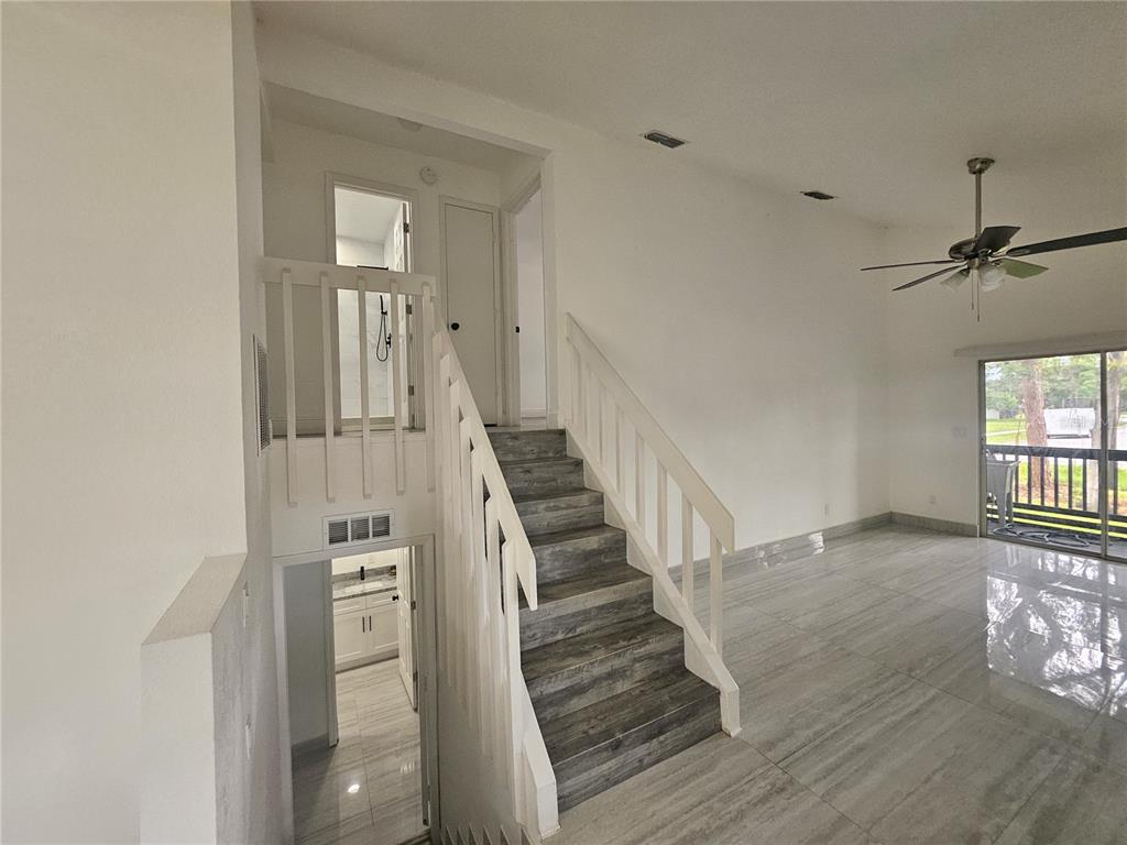 5802 Mohr Loop, Unit 5802 5804 5806 5808 Tampa, FL 33615 - Photo 12 of 40 a view of entryway and hall with wooden floor