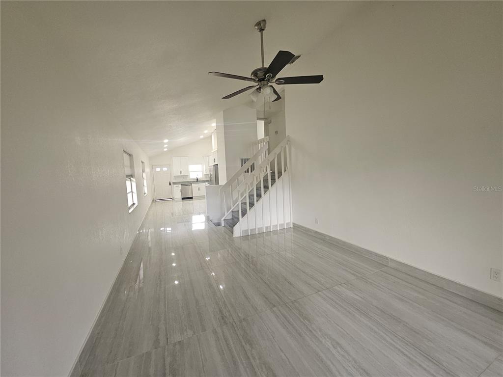 5802 Mohr Loop, Unit 5802 5804 5806 5808 Tampa, FL 33615 - Photo 14 of 40 a view of entryway and hall with wooden floor