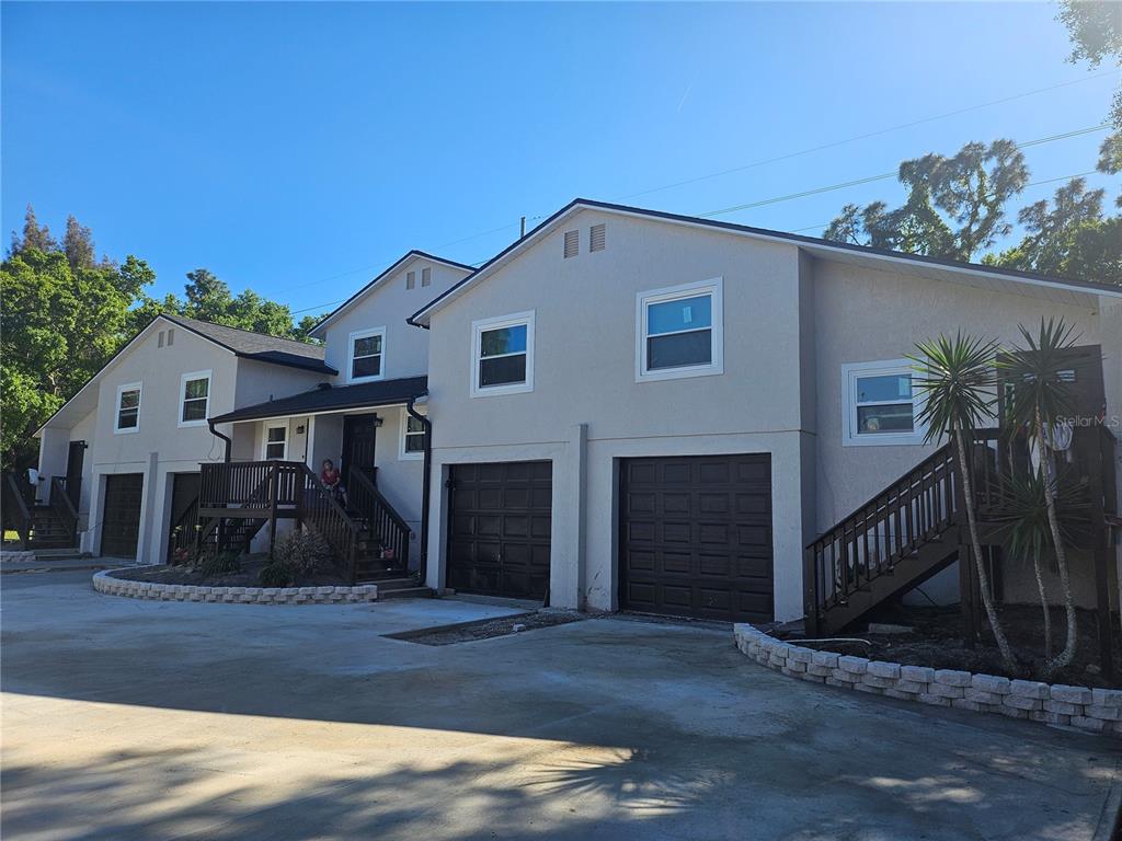 5802 Mohr Loop, Unit 5802 5804 5806 5808 Tampa, FL 33615 - Photo 2 of 40 a view of a house with a yard