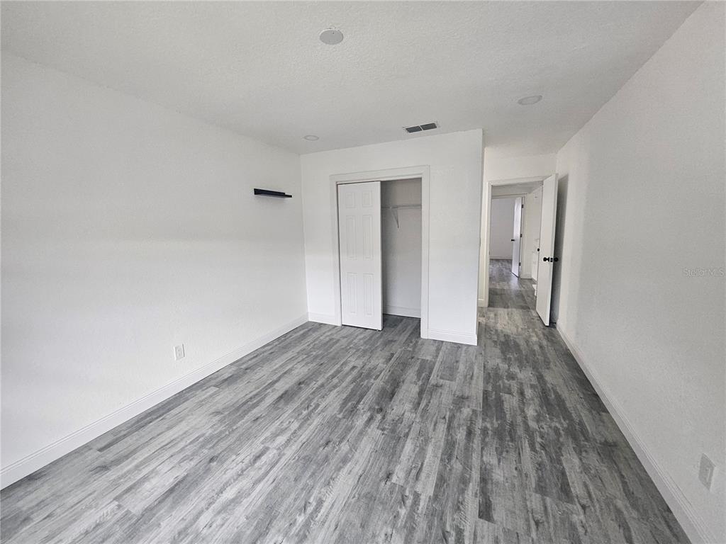 5802 Mohr Loop, Unit 5802 5804 5806 5808 Tampa, FL 33615 - Photo 30 of 40 wooden floor in a empty room