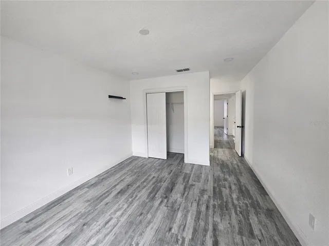 a view of wooden floor in an empty room