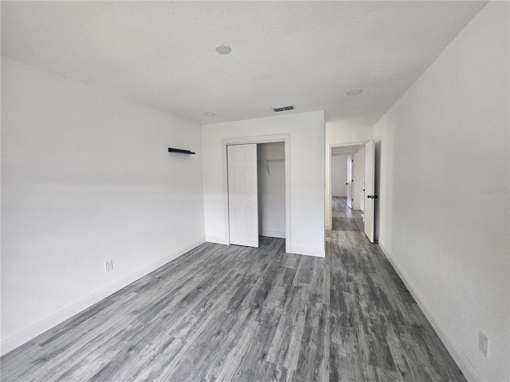 5802 Mohr Loop, Unit 5802 5804 5806 5808 Tampa, FL 33615 - Photo 31 of 40 a view of wooden floor in an empty room