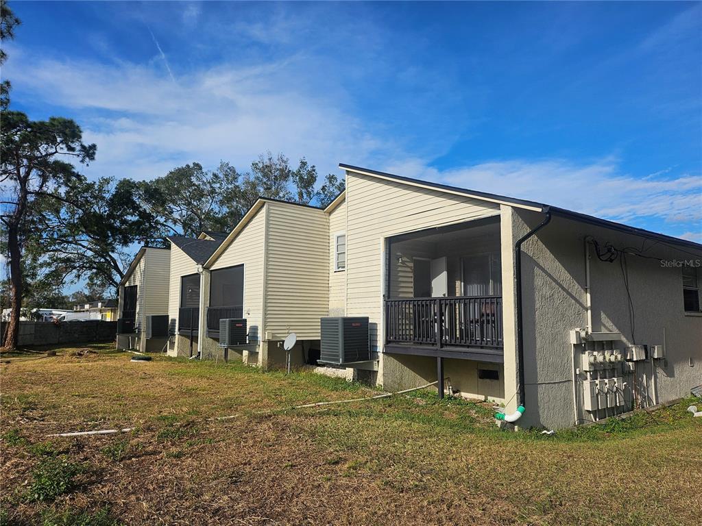 5802 Mohr Loop, Unit 5802 5804 5806 5808 Tampa, FL 33615 - Photo 40 of 40 a view of a house with a yard