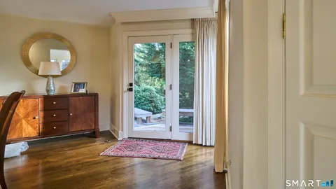 a bed room with a bed and a television