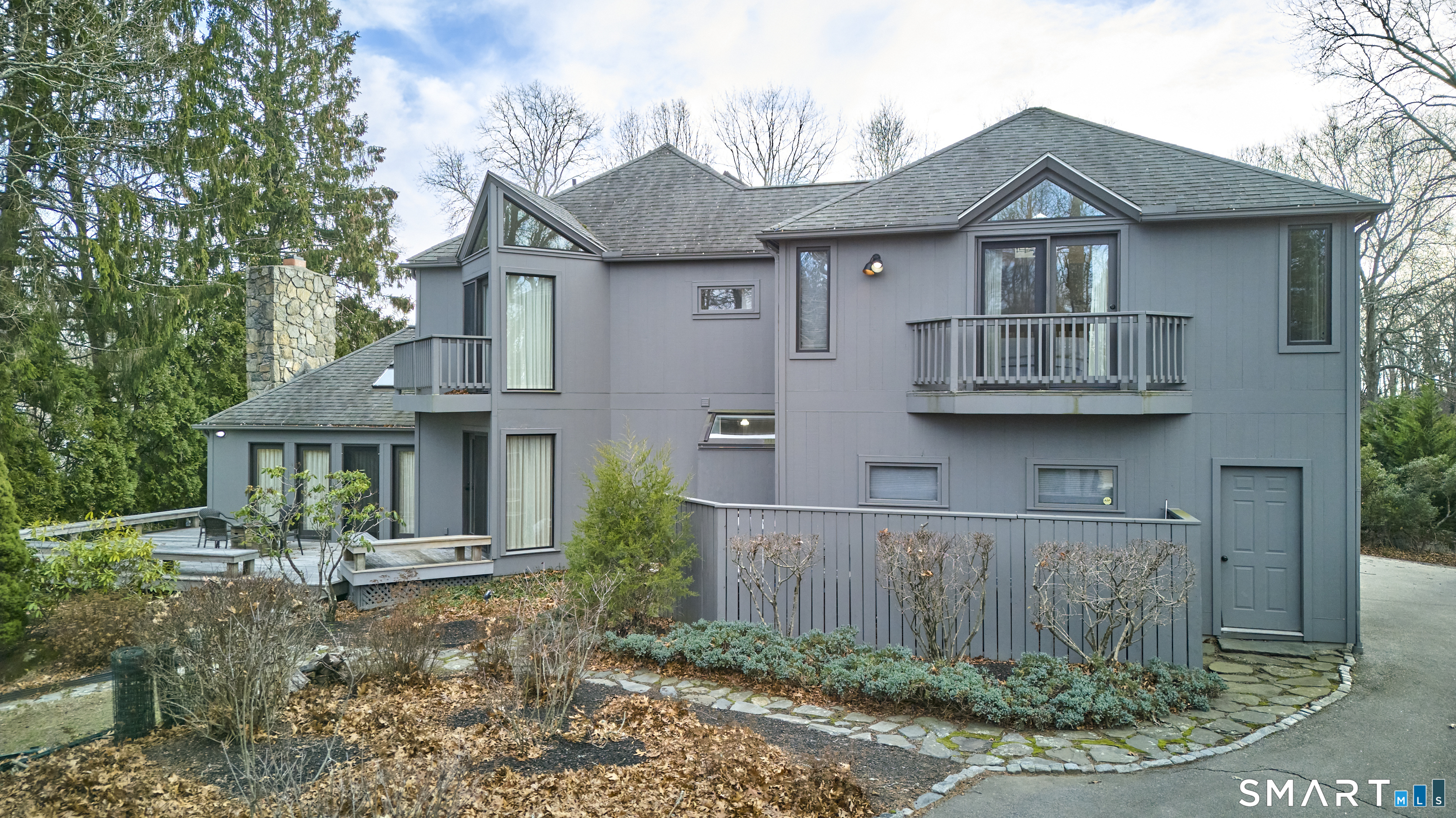 19 Money Point Road Stonington, CT 06355 - Photo 2 of 34 a front view of a house with garden