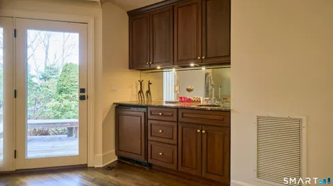 a kitchen with wooden cabinets and a sink