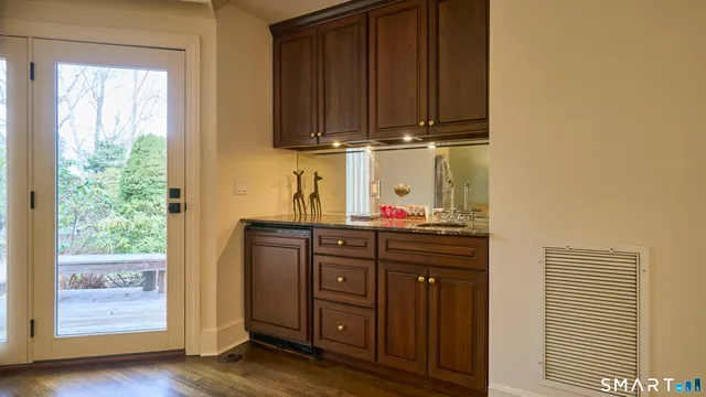 a kitchen with wooden cabinets and a sink
