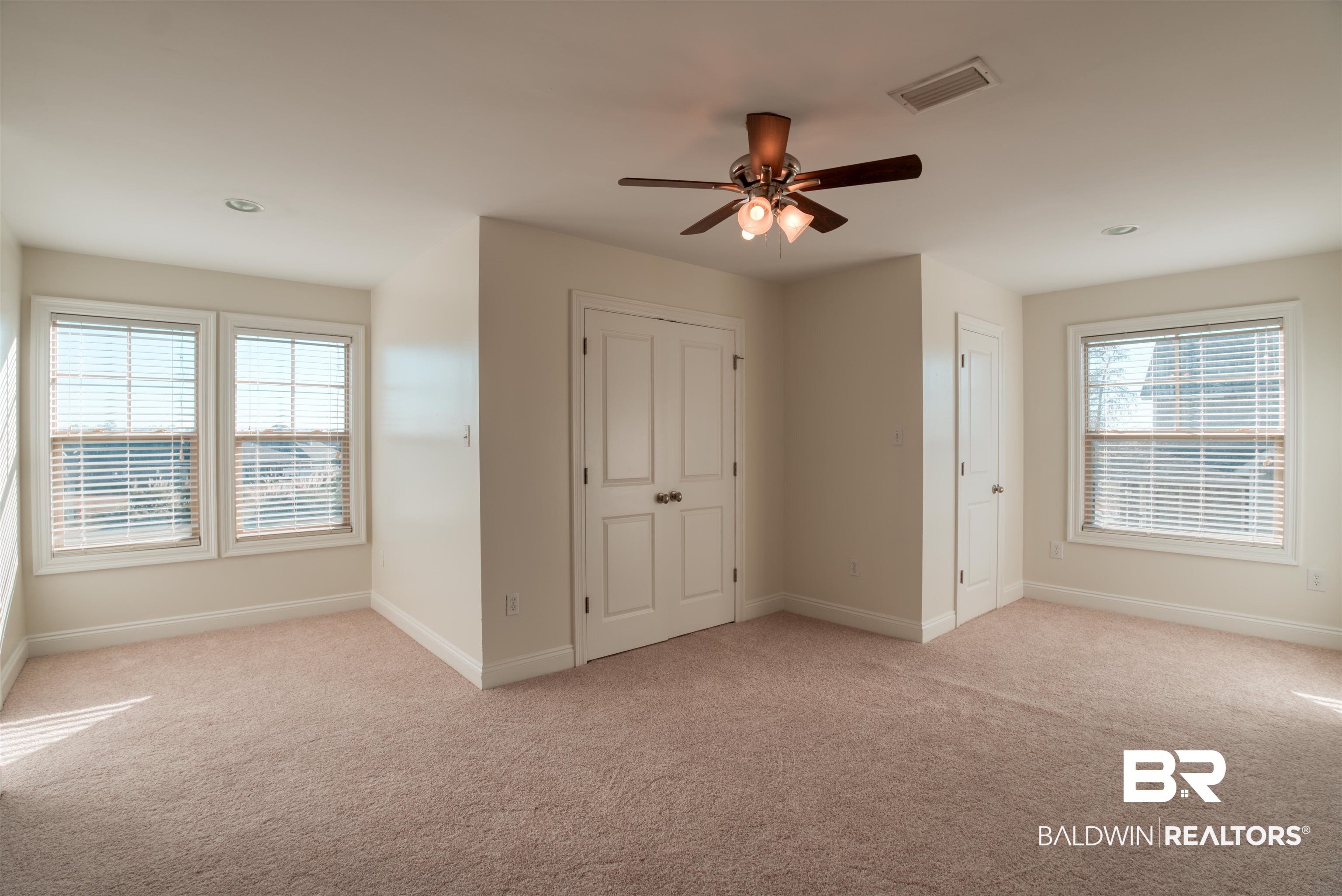 24561 Austin Road Daphne, AL 36526 - Photo 31 of 57 Unfurnished bedroom with light carpet and ceiling fan