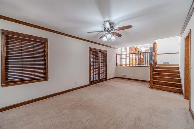 a spacious bathroom with a granite countertop sink a light fixture and a mirror