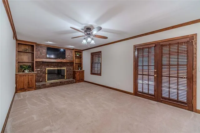 a kitchen with stainless steel appliances granite countertop a sink and a refrigerator