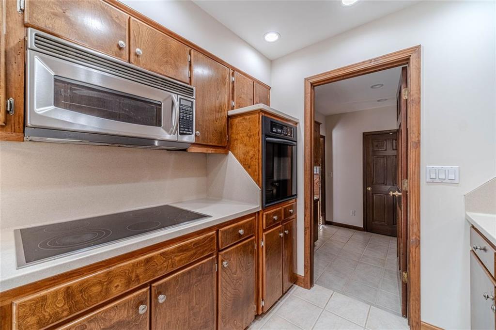 565 James Street Southwest Lilburn, GA 30047 - Photo 26 of 67 a kitchen with stainless steel appliances a refrigerator and microwave