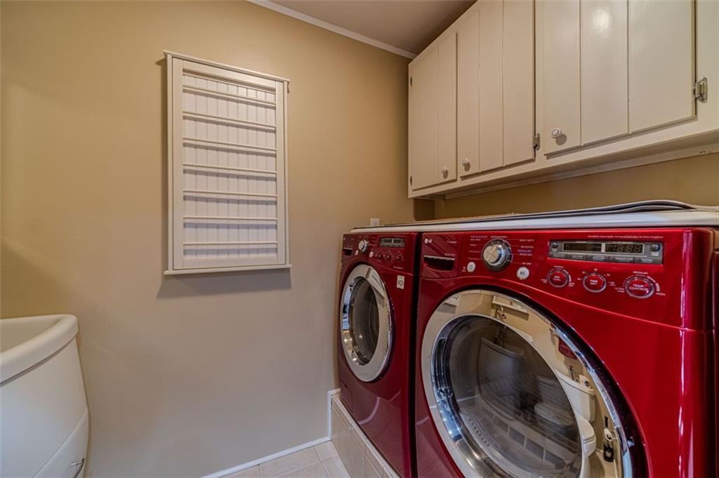 565 James Street Southwest Lilburn, GA 30047 - Photo 29 of 67 a close up view of washer and dryer