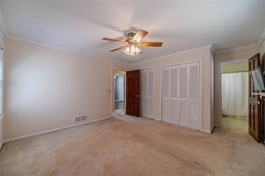 565 James Street Southwest Lilburn, GA 30047 - Photo 36 of 67 a view of a room with a ceiling fan and a chandelier fan