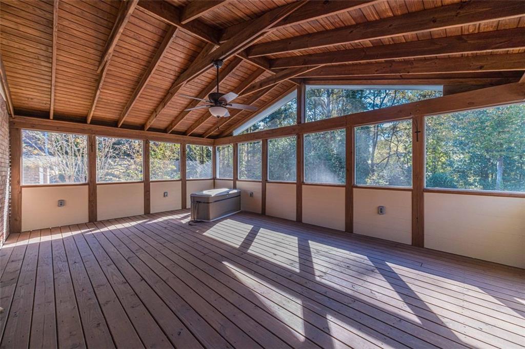 565 James Street Southwest Lilburn, GA 30047 - Photo 45 of 67 a bedroom with wooden floors and large windows