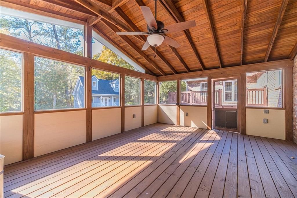 565 James Street Southwest Lilburn, GA 30047 - Photo 46 of 67 a view of an empty room with wooden floor and a window