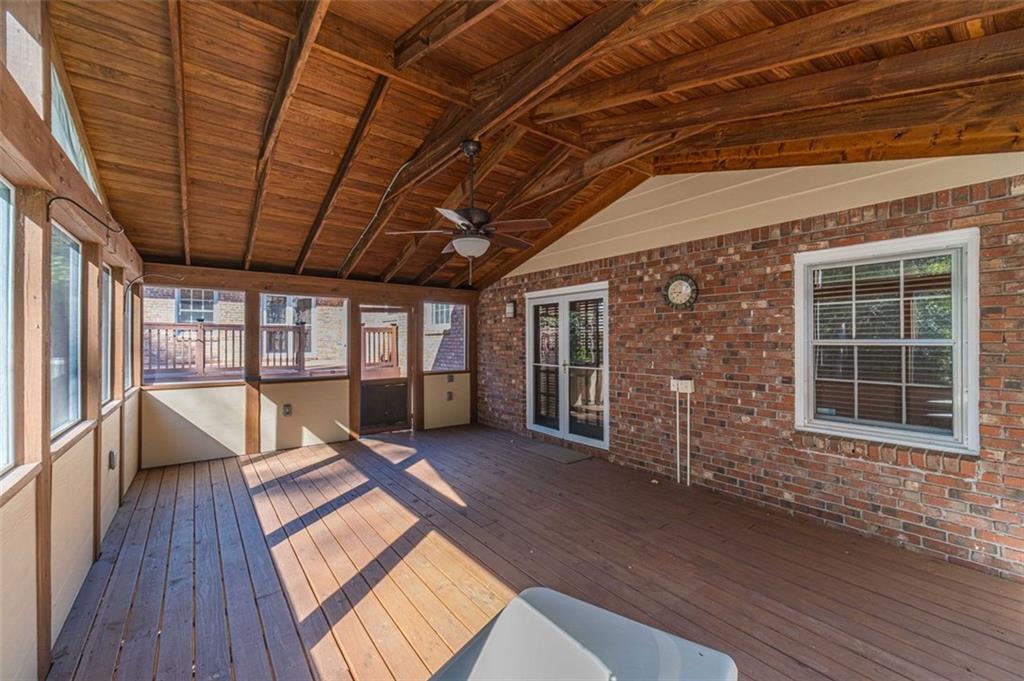 565 James Street Southwest Lilburn, GA 30047 - Photo 47 of 67 a view of an empty room with wooden floor and a window