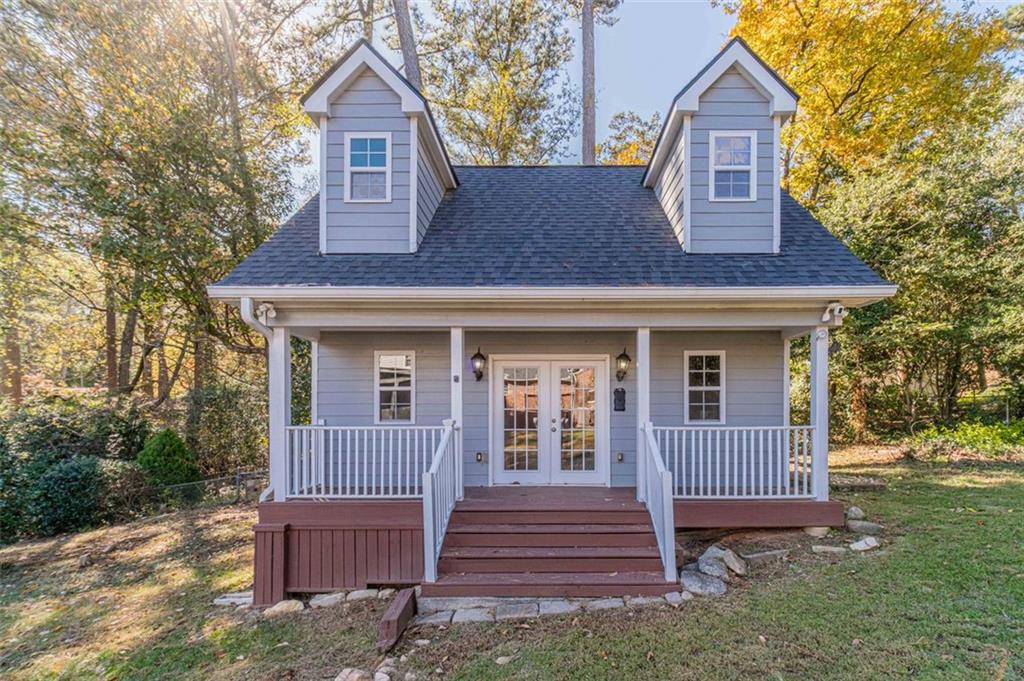 565 James Street Southwest Lilburn, GA 30047 - Photo 49 of 67 a front view of a house with a porch
