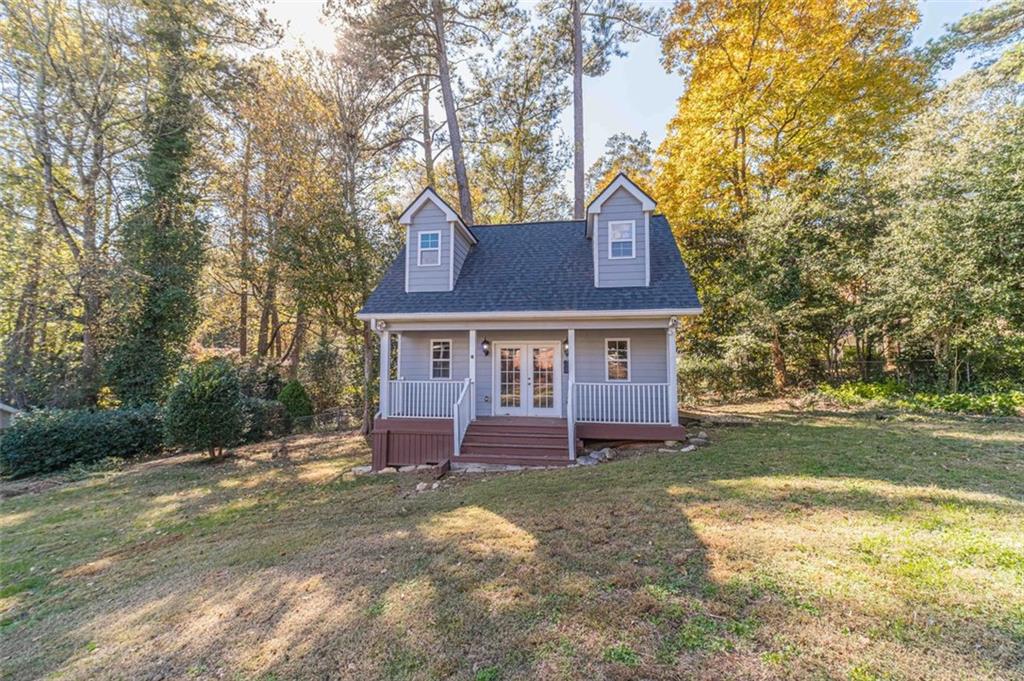 565 James Street Southwest Lilburn, GA 30047 - Photo 50 of 67 a front view of a house with a yard