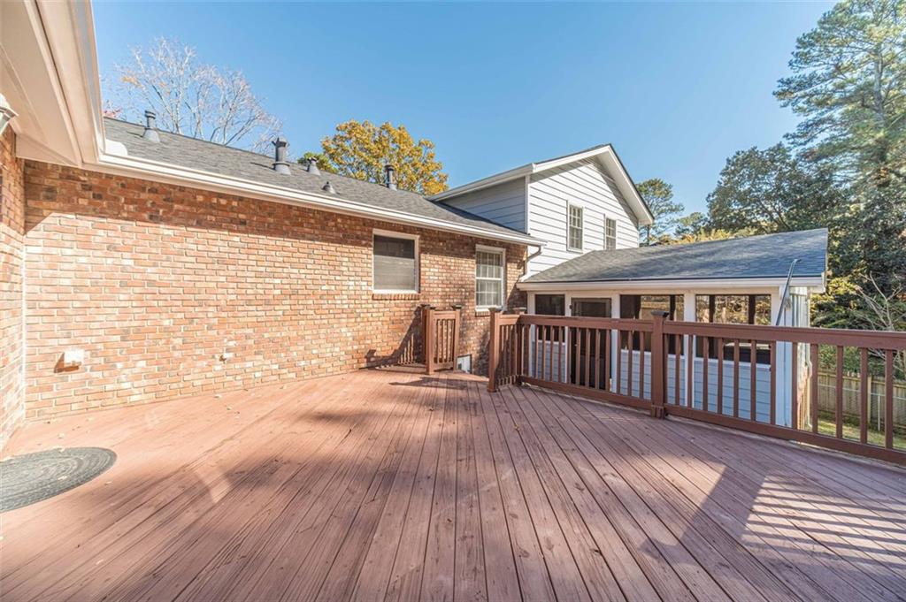 565 James Street Southwest Lilburn, GA 30047 - Photo 59 of 67 a view of a house with a roof deck