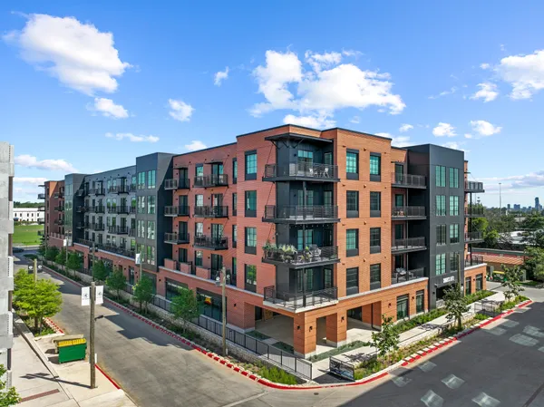 a front view of a multi story residential apartment building