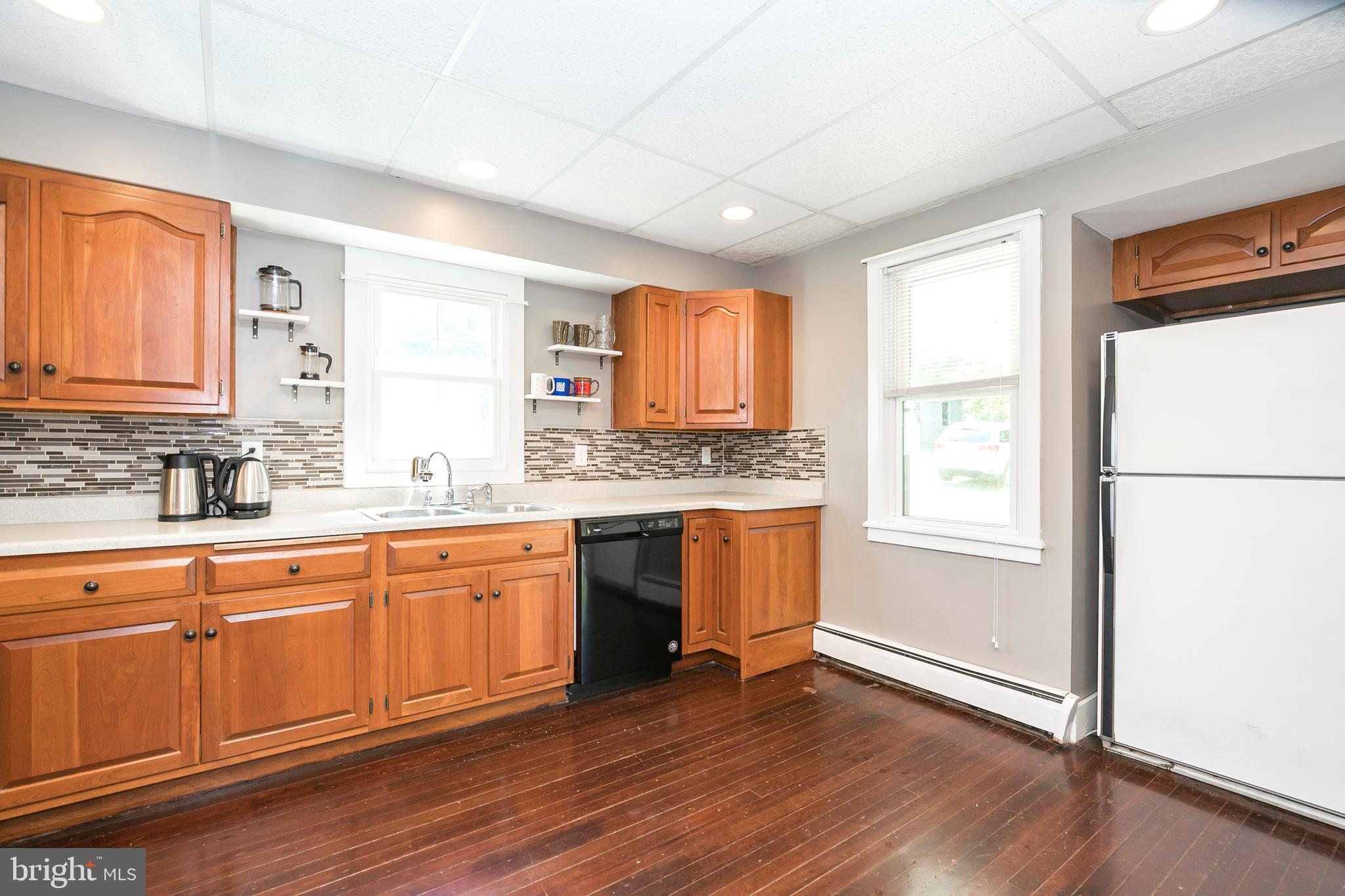 2190 School Road Pottstown, PA 19465 - Photo 13 of 30 a kitchen with granite countertop wooden floors granite counter tops and a window
