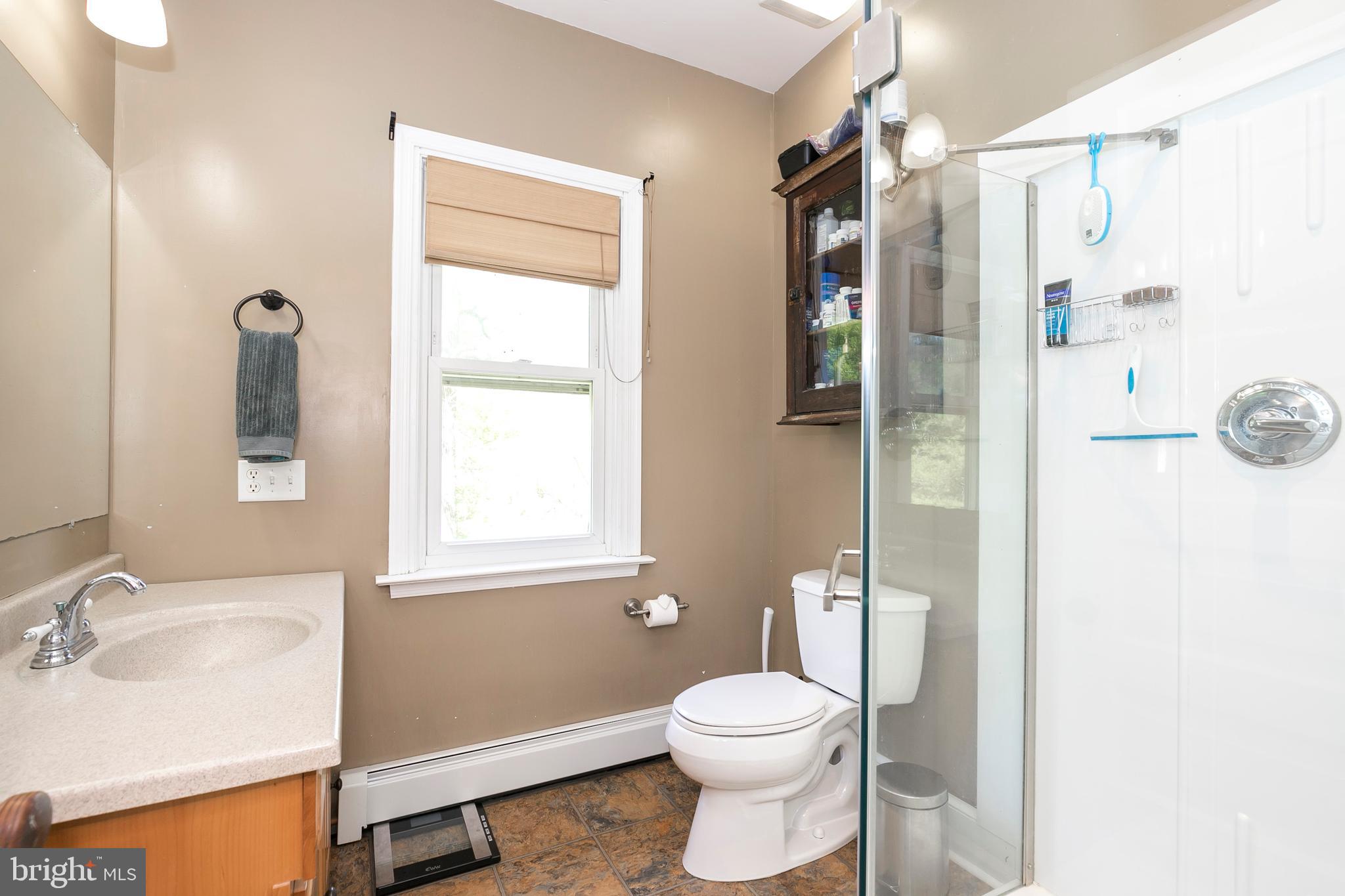 2190 School Road Pottstown, PA 19465 - Photo 19 of 30 a bathroom with a sink toilet and shower