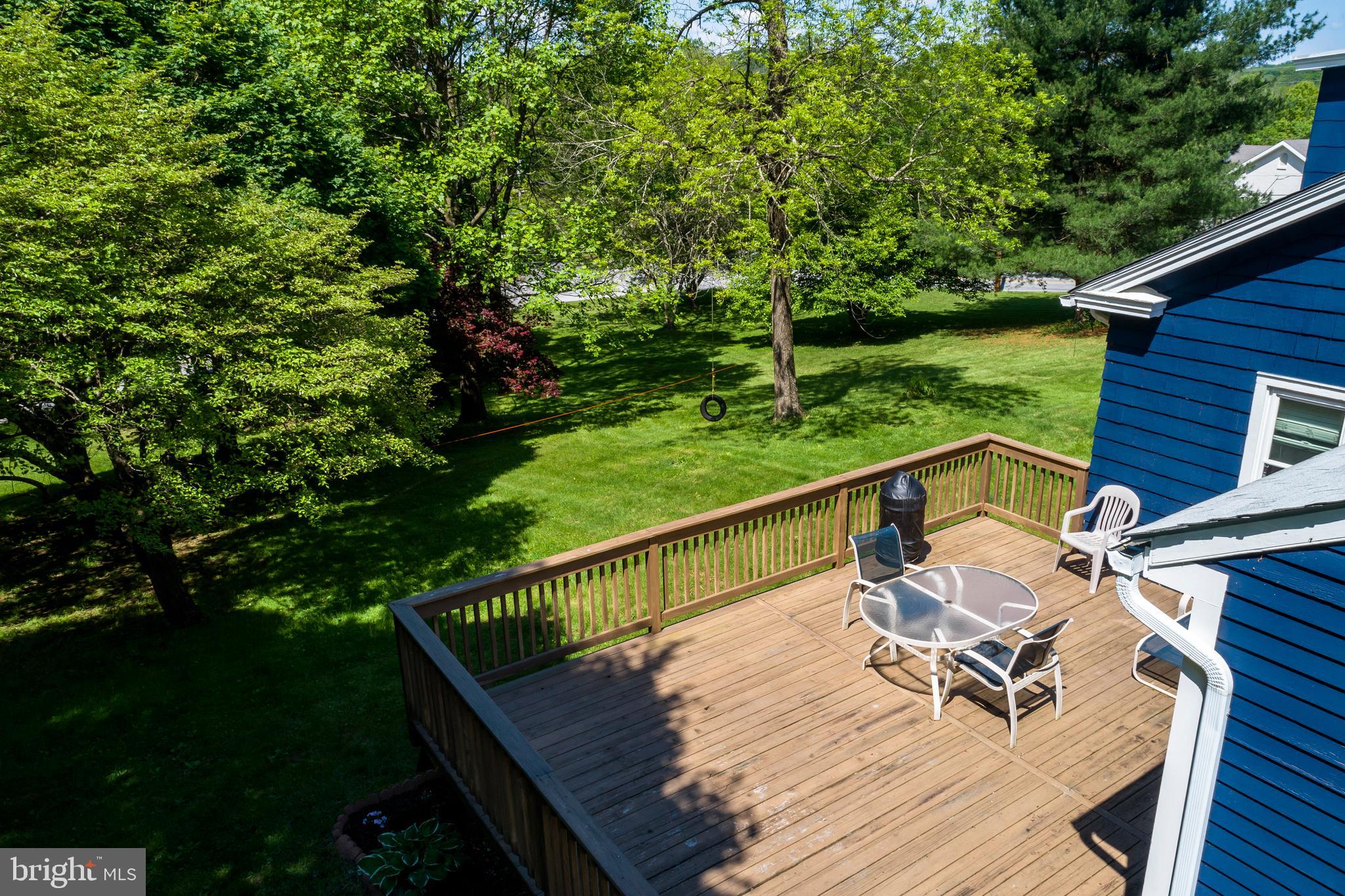 2190 School Road Pottstown, PA 19465 - Photo 23 of 30 a view of deck with furniture and trees