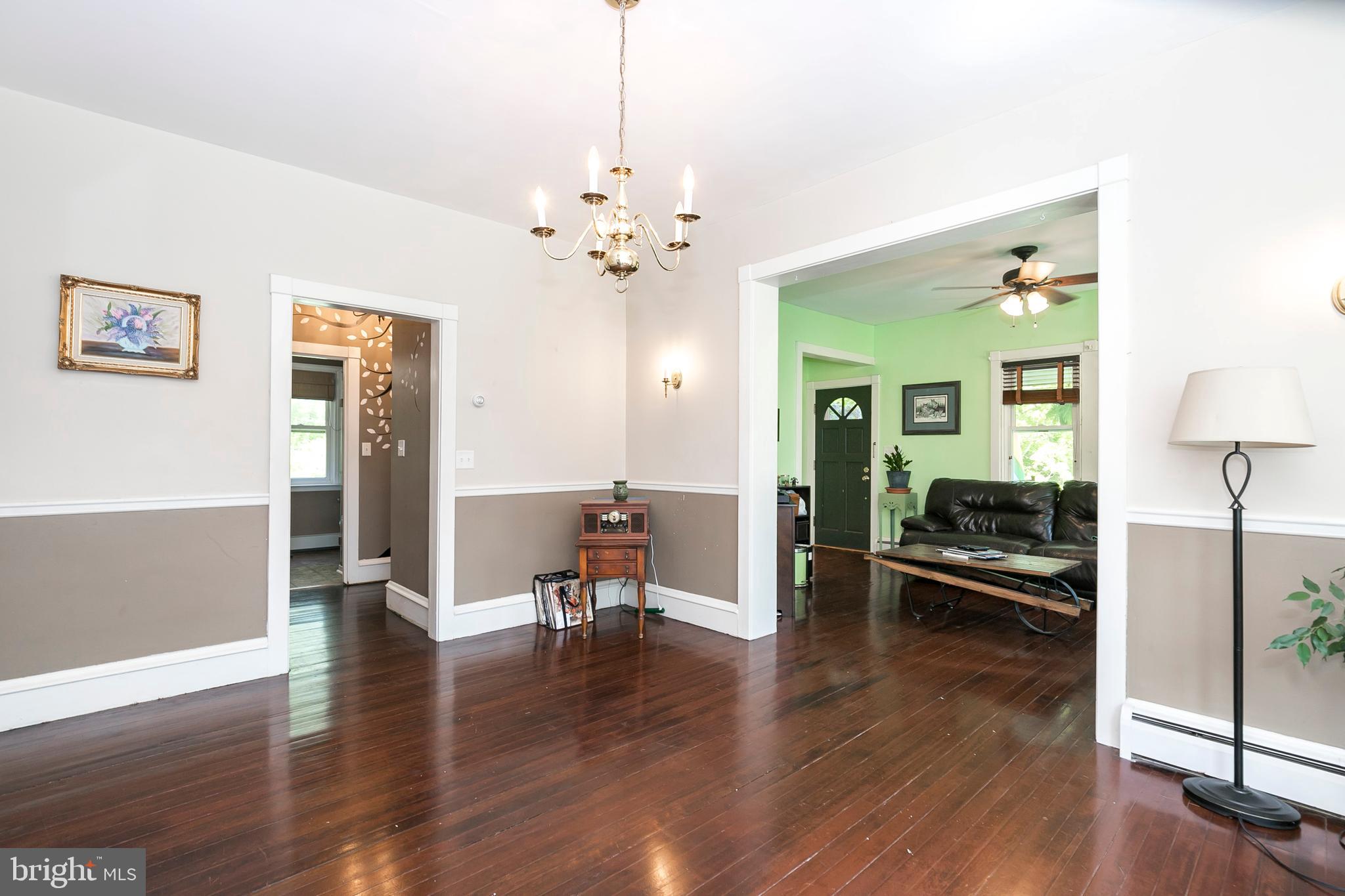 2190 School Road Pottstown, PA 19465 - Photo 9 of 30 a view of a livingroom with furniture wooden floor a chandelier