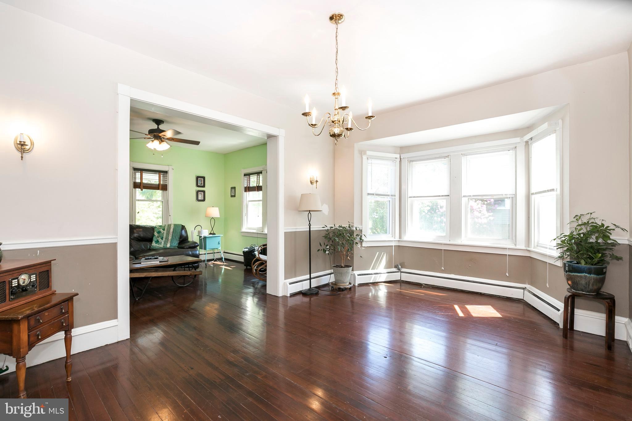 2190 School Road Pottstown, PA 19465 - Photo 10 of 30 a view of an livingroom with furniture wooden floor and a chandelier