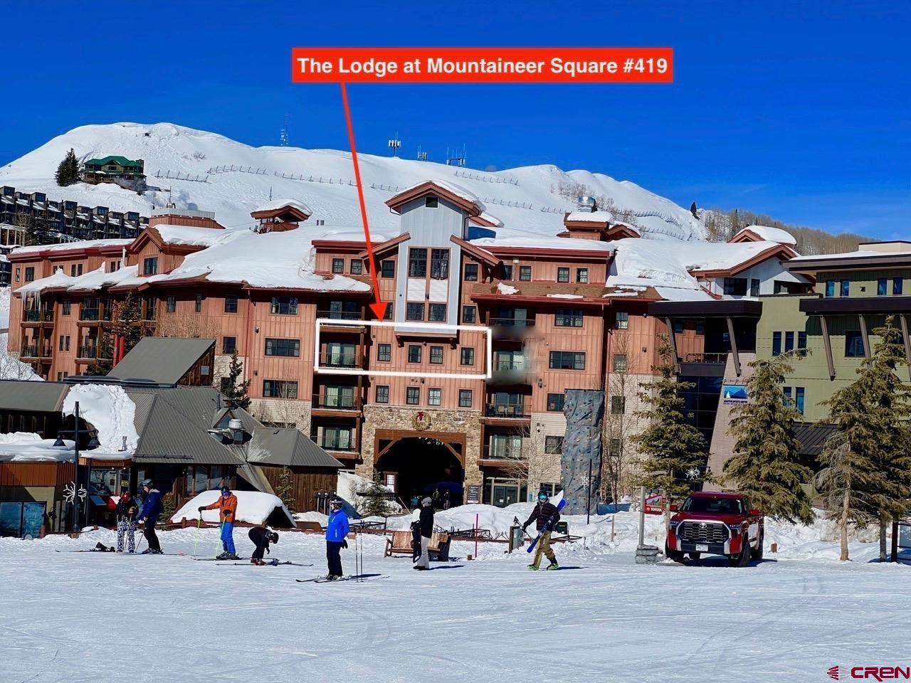 a group of cars parked in front of building